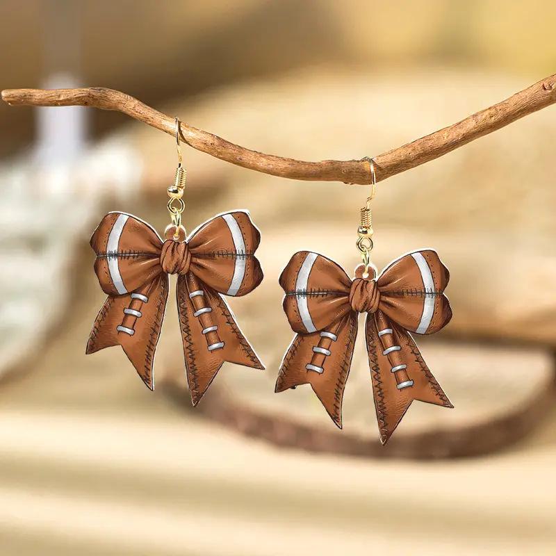 

Sports Game Football Rugby Element Bow Acrylic Earrings Creative Design Fashion Earrings