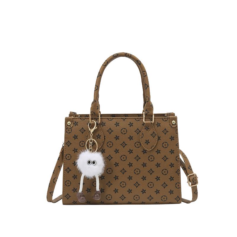 

Elegant French Crossbody Bag: Large-Capacity, Embossed, Versatile Shoulder Bag for Commuting Bag Only коричневий