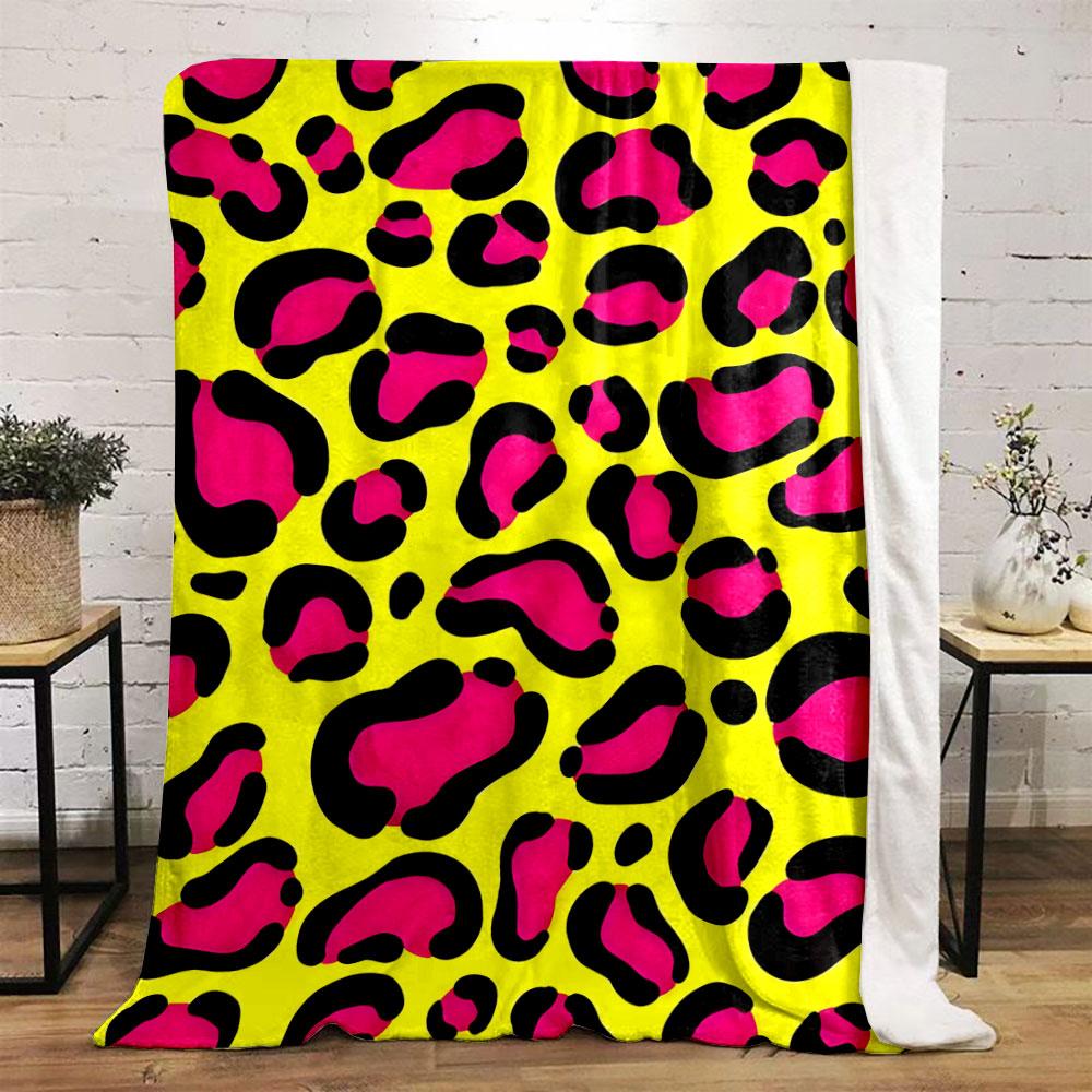Bright pink leopard spots outlined in black on a yellow background. for all seasons blanket lunch break throw gift
