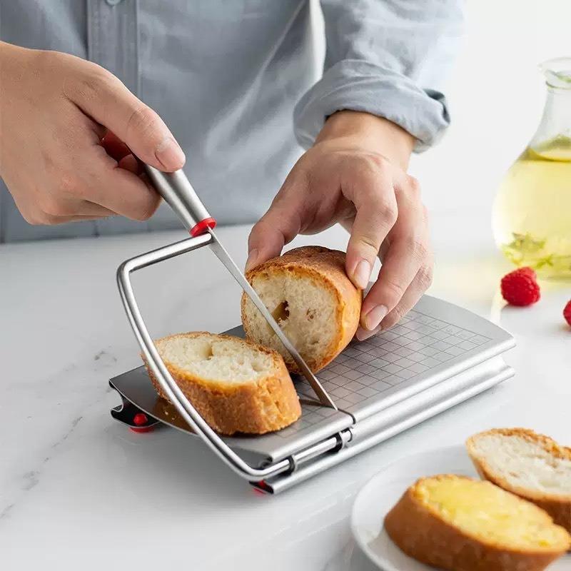 Stainless steel cheese slicer with anti slip scale measuring plate, used for cutting cakes, ham, butter in home restaurants and kitchens