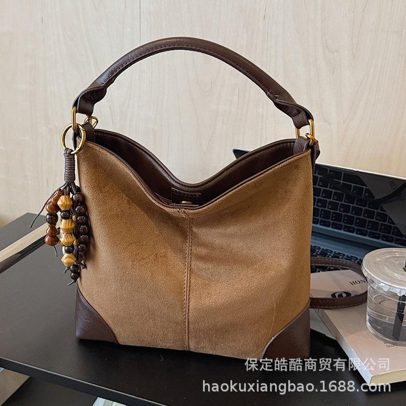 Leopard print bag women's 2025 new trendy autumn and winter niche portable bucket bag high-end exquisite messenger bag women's bag