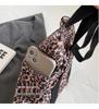 Leopard Print Canvas Tote: Large Capacity Autumn Shoulder Bag for Women, Versatile for College and Commute.