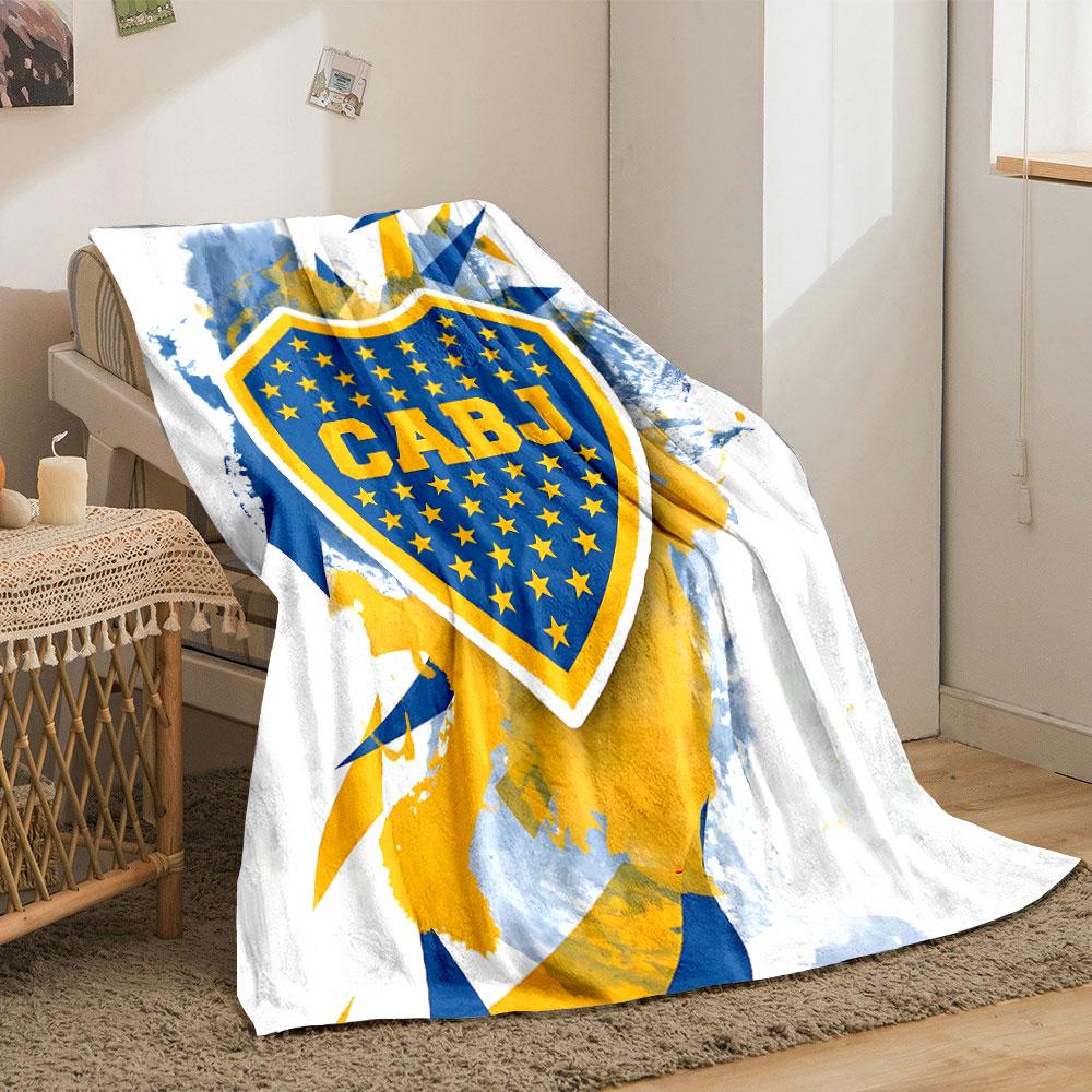 Blue and yellow shield with stars, splattered background, angular shapes. for all seasons blanket lunch break throw gift