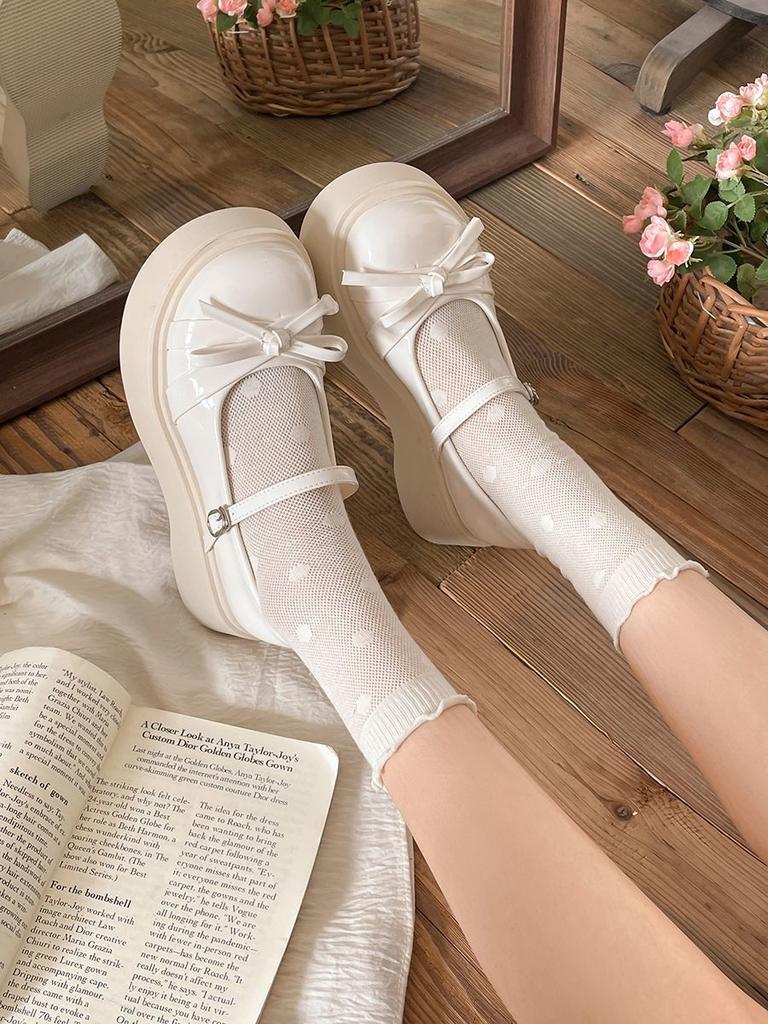 Small Japanese one-word leather shoes 2025 winter new round head bow platform women's shoes increase height fashion Mary Jane