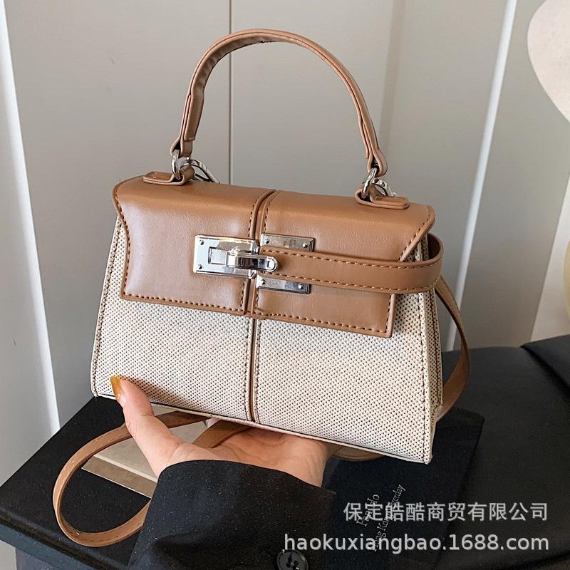 Korean version of high-quality, simple and versatile commuter handbag women's 2025 summer new niche messenger small square bag