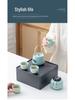 Portable Ceramic Kung Fu Tea Set: Teapot with Handle and Four Cups for Travel and Business Gifting