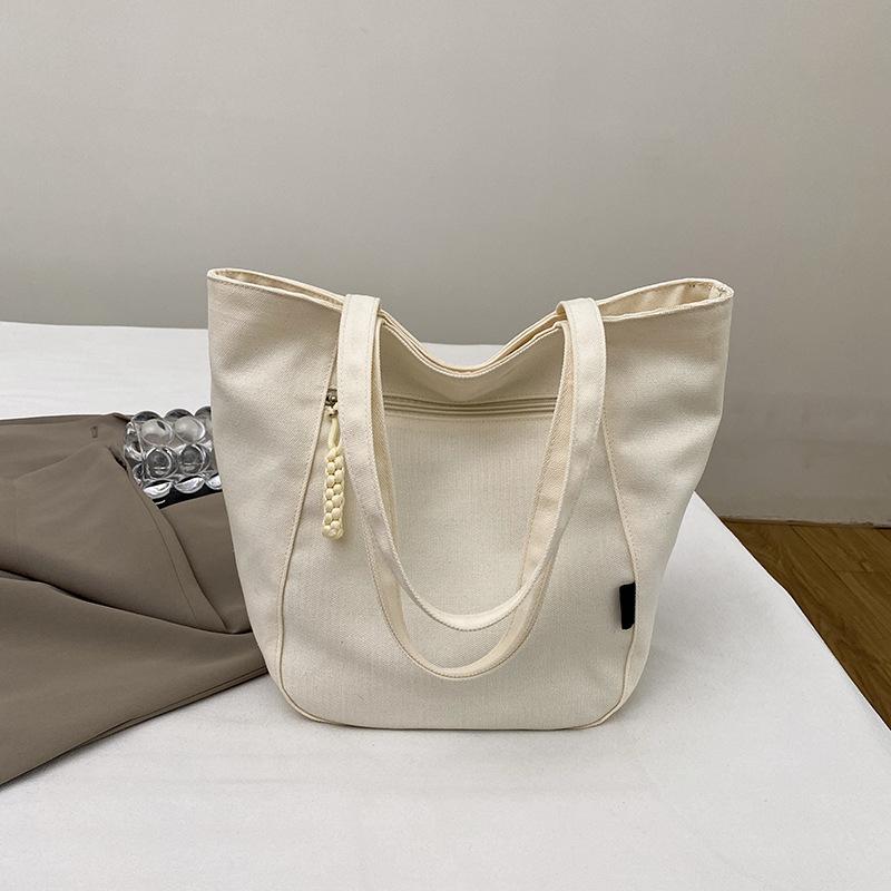 Customized bags for women 2025 new large-capacity tote bags, commuter tote bags, student women's shoulder bags.