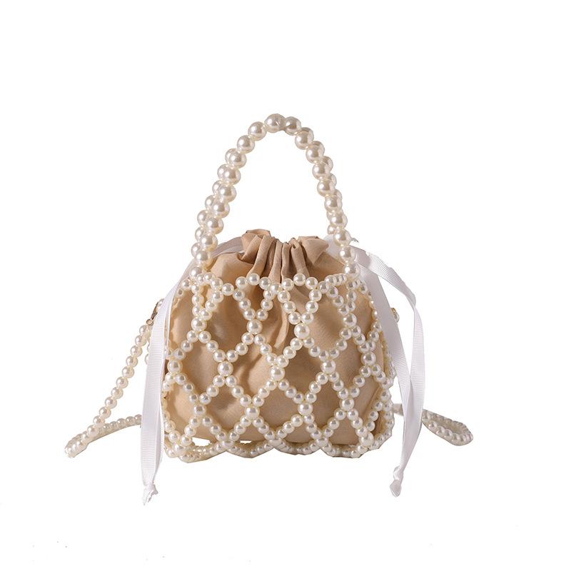 Bag exquisite hand-woven hollow personality women's handbag new imitation pearl woven shoulder messenger bag