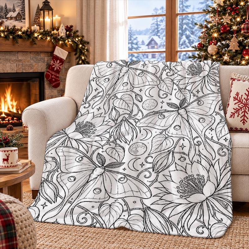 A Flannel Blanket with a Moonlit Moth and Flower Vine Entwined Print. Suitable for Bedrooms, Living Rooms, Offices, Cars, Travel, and Camping. A Gift