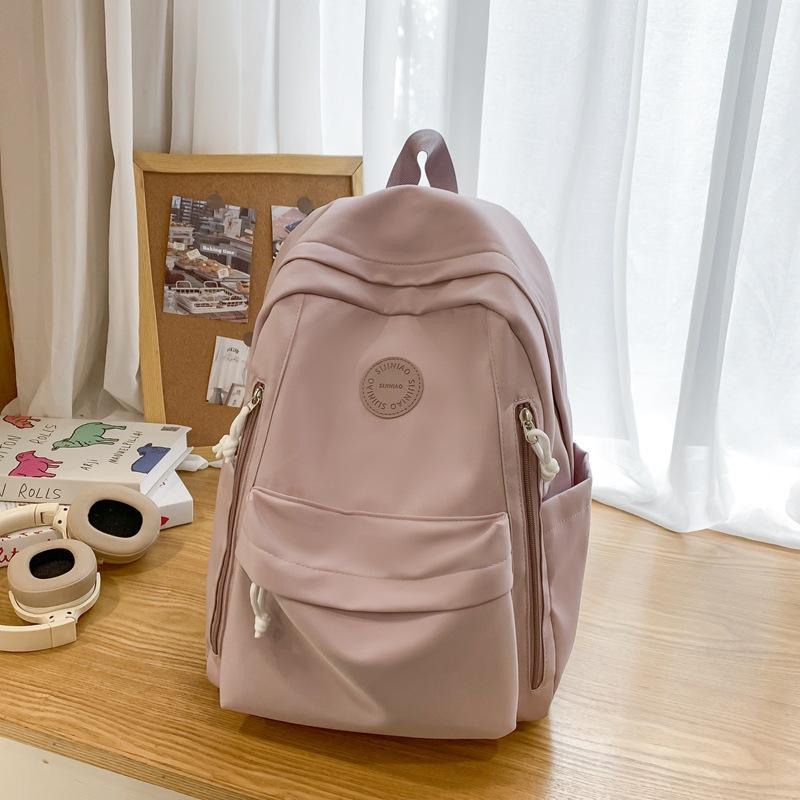 Einfacher einfarbiger leichter Rucksack Mädchen Joker Junior High School Alle Rucksäcke Shopping-Rucksack.