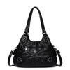 Shoulder leather locomotive bag New large-capacity women's bag Atmospheric commuter bag Woven leather button pleated bag
