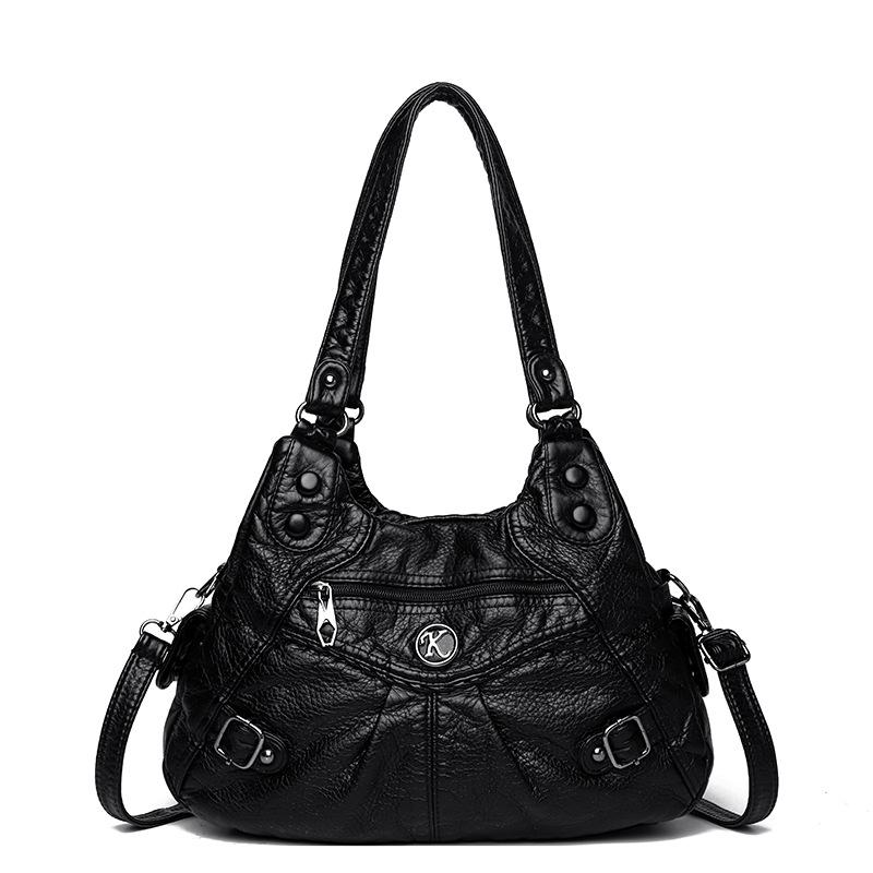 Shoulder leather locomotive bag New large-capacity women's bag Atmospheric commuter bag Woven leather button pleated bag
