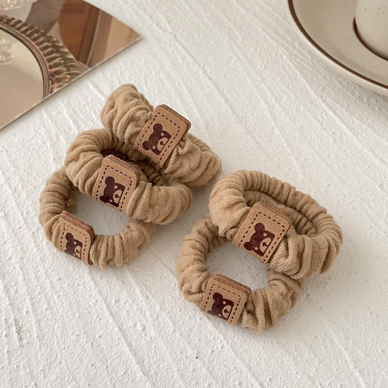 

Високоеластичні гумки для волосся кольору молочної кави для дівчаток – Міцні, ніжні до волосся, прості та стильні.