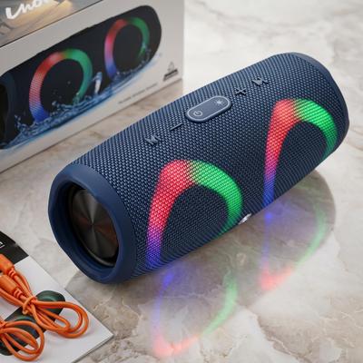Bluetooth reproduktor (válcový design), modrá látková povrchová úprava, RGB světelné efekty, odolné a přenosné, výkonný zvuk, úžasné vizuální efekty