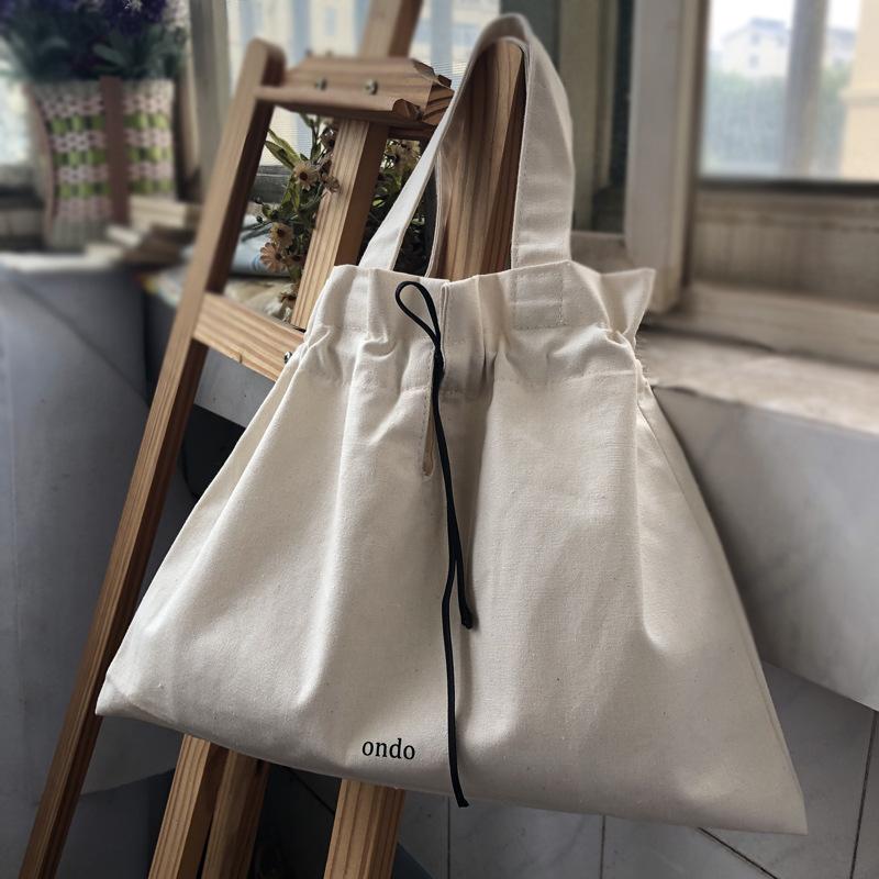 

ins Japanese small hand carry canvas bag Korean version drawstring carry-on bag casual versatile change bag mini bag