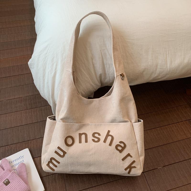 

Fashion bag women s 2025 autumn and winter new large-capacity shoulder tote bag niche versatile commuter fabric tote bag 35*10*28