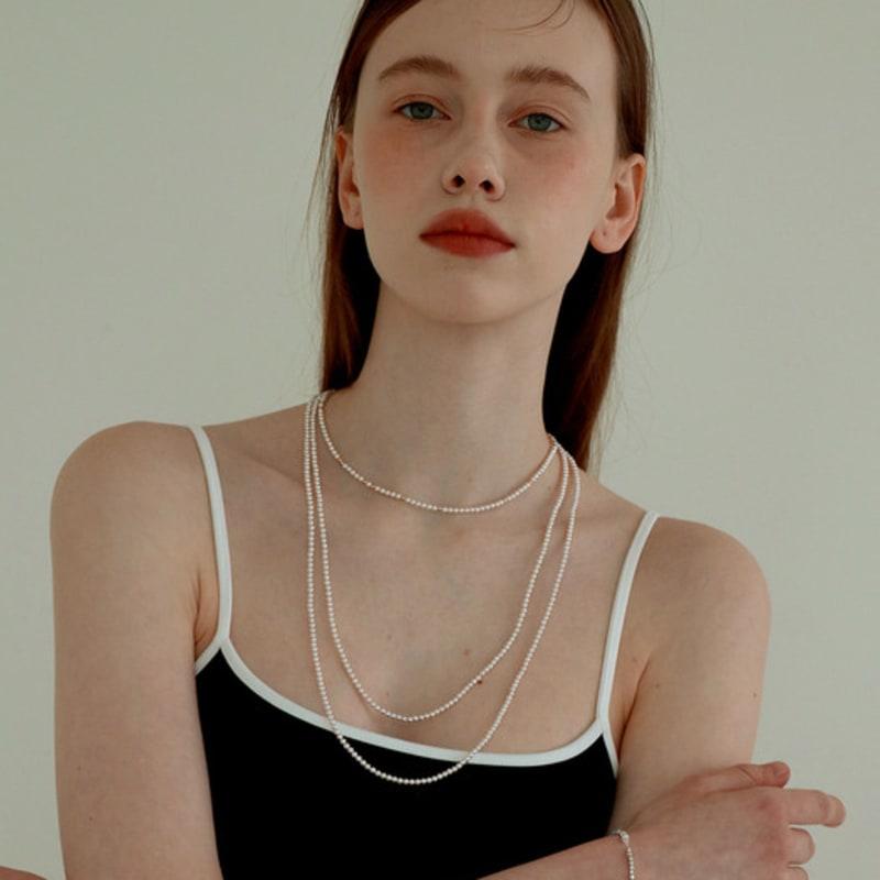 Less is more long pearl necklace