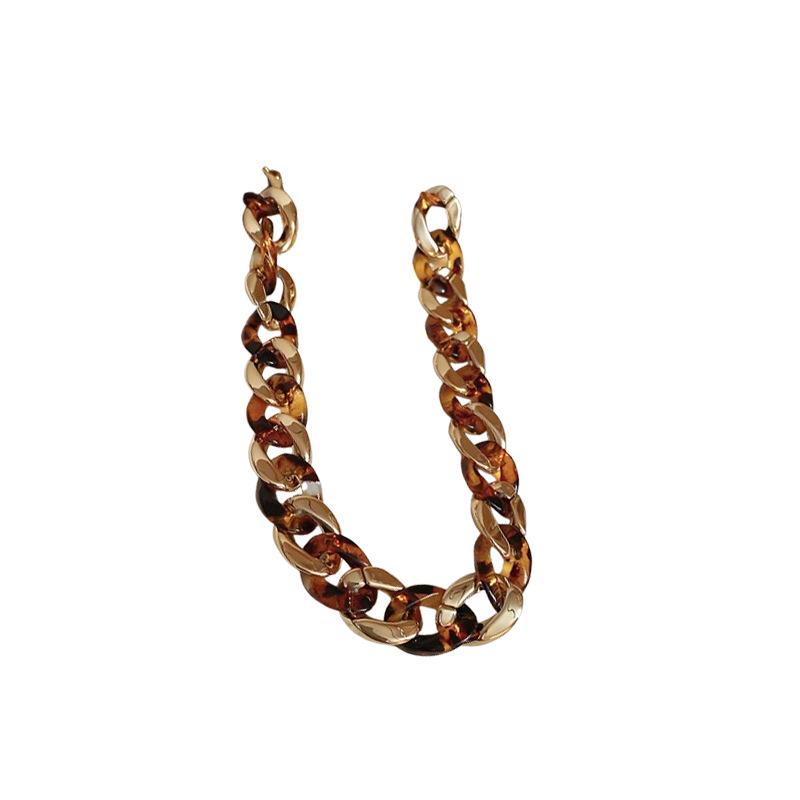 Meillard Leopard Print Jewelry Set: Interlocking Earrings, Necklace, Bracelet, and Ear Studs.