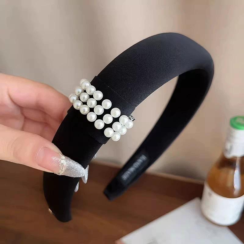 Zhao Ruth has the same black pearl headband for women's foreign light luxury headband hair jewelry.