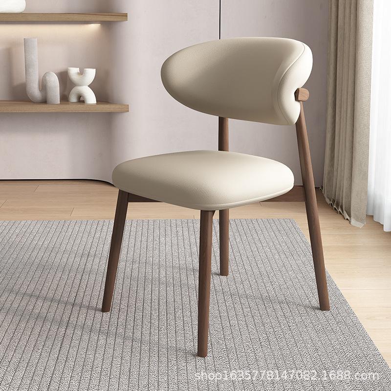 Nordic Modern Minimalist Solid Wood Dining Chair with Soft Pack Backrest - Comfortable Light Luxury Ram's Horn Design for Home, Restaurant, and Hotel.