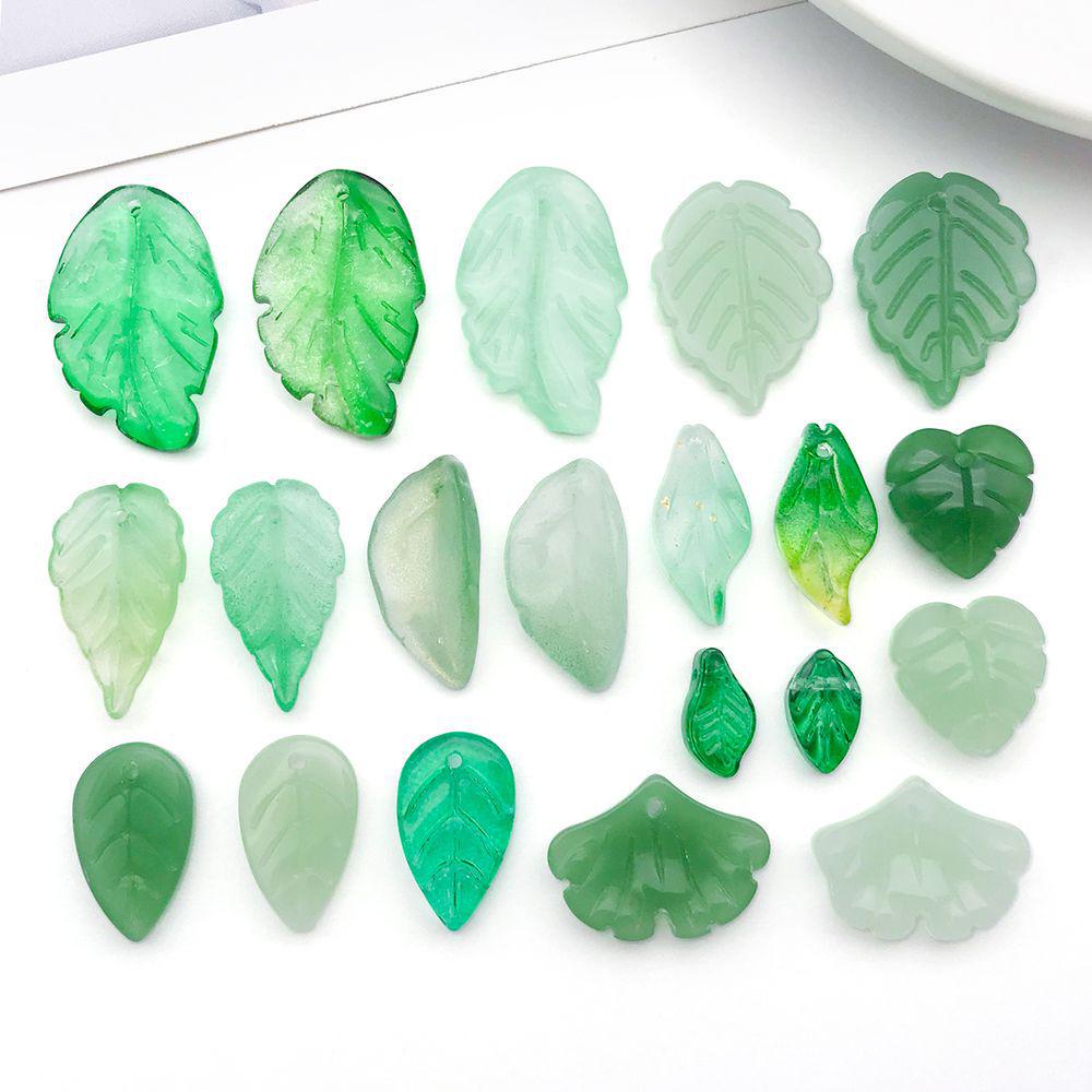 Set of 20 Green Transparent Faux Glass Leaf Pendants for DIY Bracelets, Necklaces, and Video Accessories.