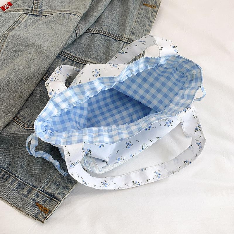 2025 new floral plaid drawstring shoulder bag student Korean version handbag large capacity portable ins commuter bag