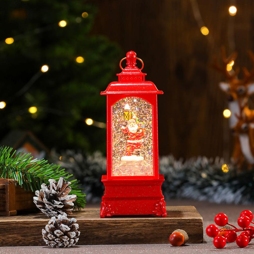 O varietate de apă de Crăciun umplută cu ornamente muzicale, cabine telefonice, lămpi cu ulei, lumini de vânt, decorațiuni de Crăciun, cadouri de Crăciun