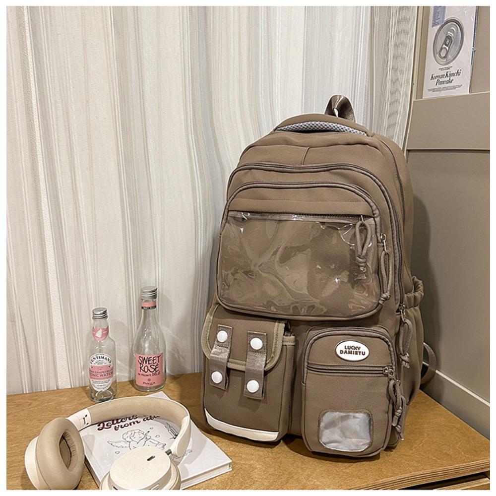 

New high-value college style backpack for junior high school students, casual, simple and light commuting, versatile and large-capacity backpack. коричневый