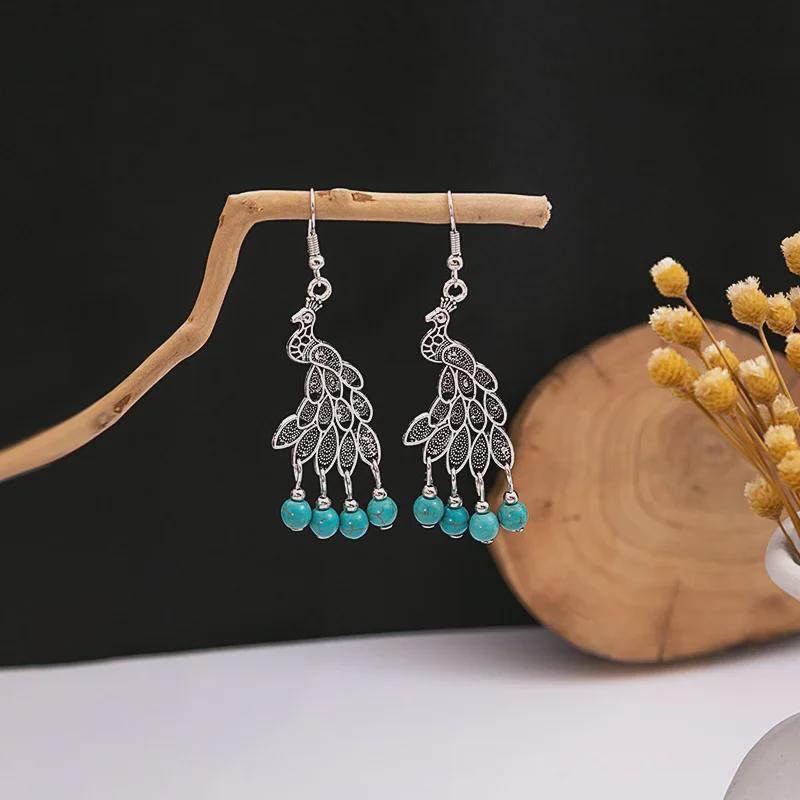 Boucles d'oreilles bohèmes à pompons turquoise bleu pour femmes