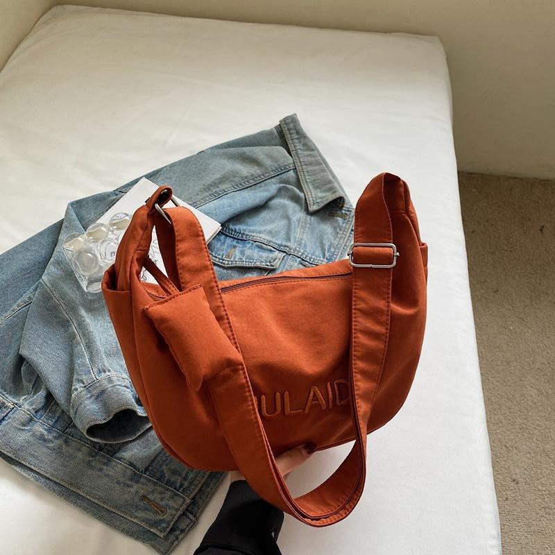

This year, the popular canvas bag ladies 2025 autumn new commuter leisure messenger bag to work large-capacity shoulder bag оранжевый