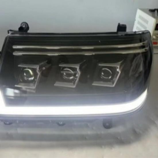 Compatible with Toyota Land Cruiser LC100 1998-2007 Headlight Assembly with LED Daytime Running Lights and Turn Signals.