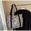 Leopard Print Canvas Tote: Large Capacity Autumn Shoulder Bag for Women, Versatile for College and Commute.