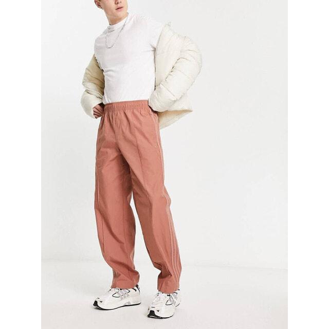 

Зауженные к низу брюки с логотипом adidas Originals