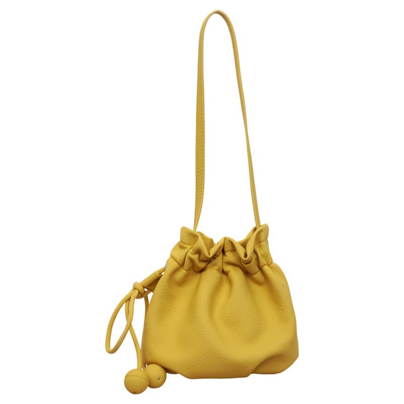 

2026 New Drawstring Bucket Bag for Women Soft Leather Crossbody Bag with Ball Charm Mini Shoulder Handbag for Daily Shopping жовтий