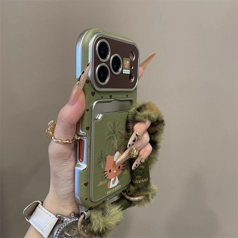 

Green bottom coconut tree KT cat is suitable for iPhone17pro mobile phone case Apple 16pro mirror card bag 15pro. iPhone17