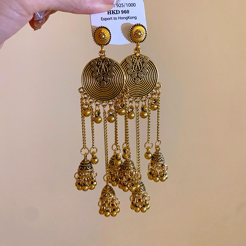 

Silver needle ethnic style round copper bell fringed earrings niche light luxury earrings high-end retro personalized earrings
