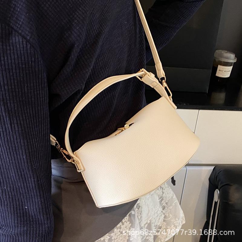 2025 new solid color temperament handbag large-capacity women's bag niche casual one-shoulder real high-end messenger bag