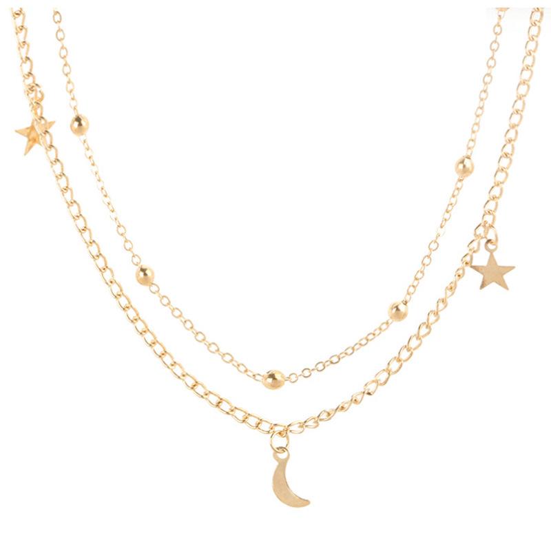 

Простое двухслойное ожерелье с луной и звездой и круглыми бусинами золотой
