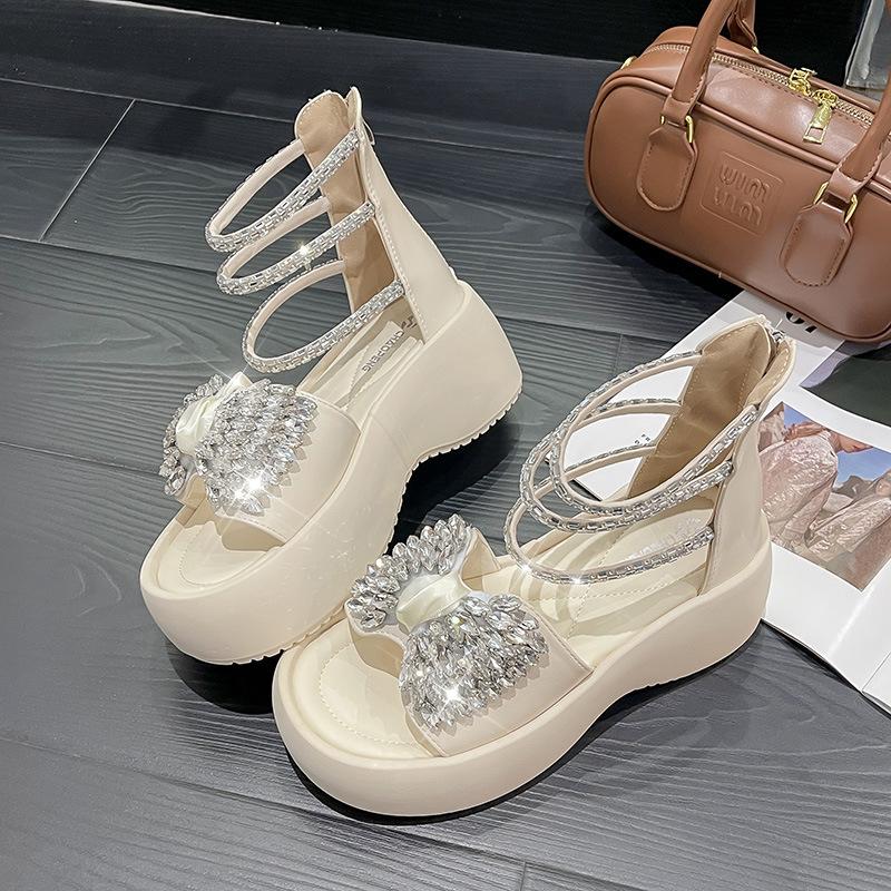 

Fashion bow muffin platform rhinestone sandals women s 2025 summer new fairy wind heightening European Roman shoes 35 бежевый