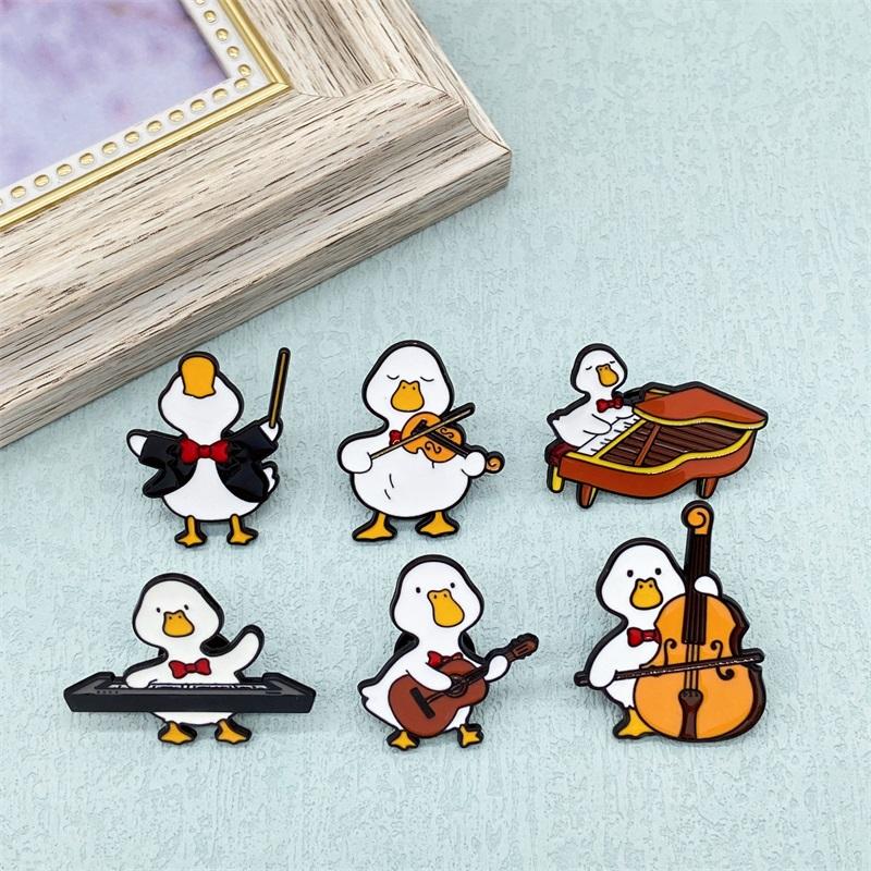 Cute Musician Duck Enamel Brooch Creative Cartoon Violin Piano Baton Guitar Animals Lapel Pins Backpack Jewelry Gifts For Kids