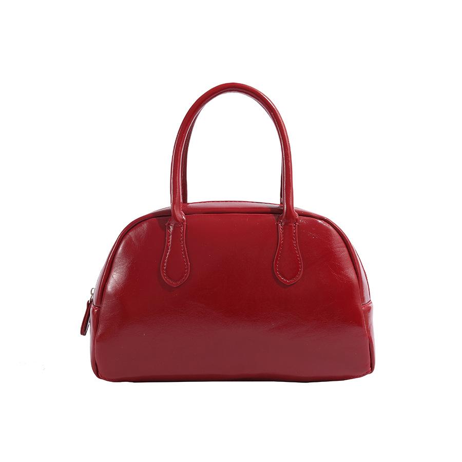 2025 Neue Koreanische Dongdaemun Nischen Handgehaltene Kissen Tasche für Damen Einfache Textur Pendler Handgehaltene Boston Tasche