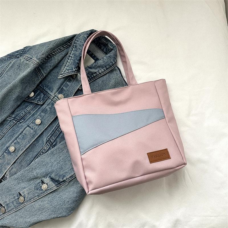 

Women s bag 2025 new fashion contrasting color large capacity Oxford Buttot bag tide Korean version simple student textbook bag фиолетовый