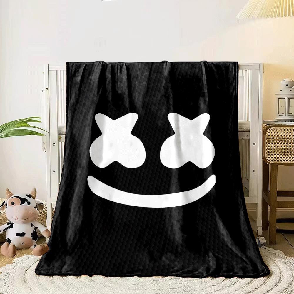 A smiley face with X-shaped eyes on a textured black background. for all seasons blanket lunch break throw gift 80cm x 120cm