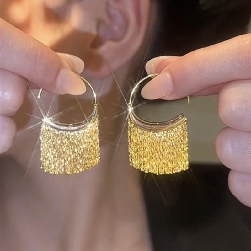 Silver Needle Sequin Tassel Earrings: Chic Cold Style, High-End Design, Fashionable Dangle for a Sophisticated Look.