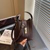 Fashion hand carrying bucket bag women's autumn and winter new niche simple casual woven shoulder messenger bag
