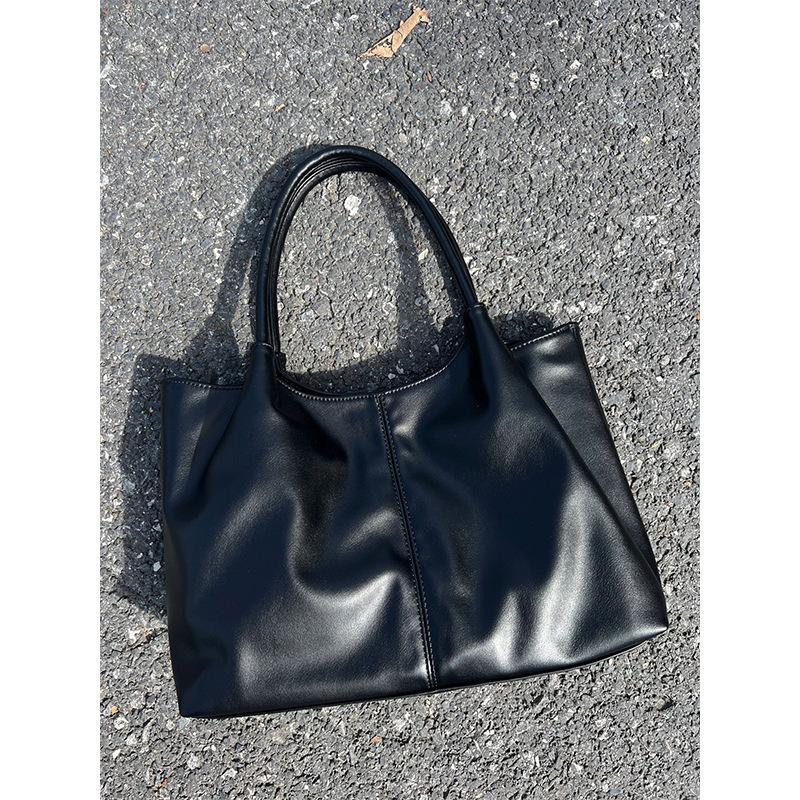 

High texture women s hand-held women s tote niche fashion large capacity commuter shoulder bag чорний