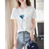 Demana Baumwollpflanzen-Stickerei T-Shirt