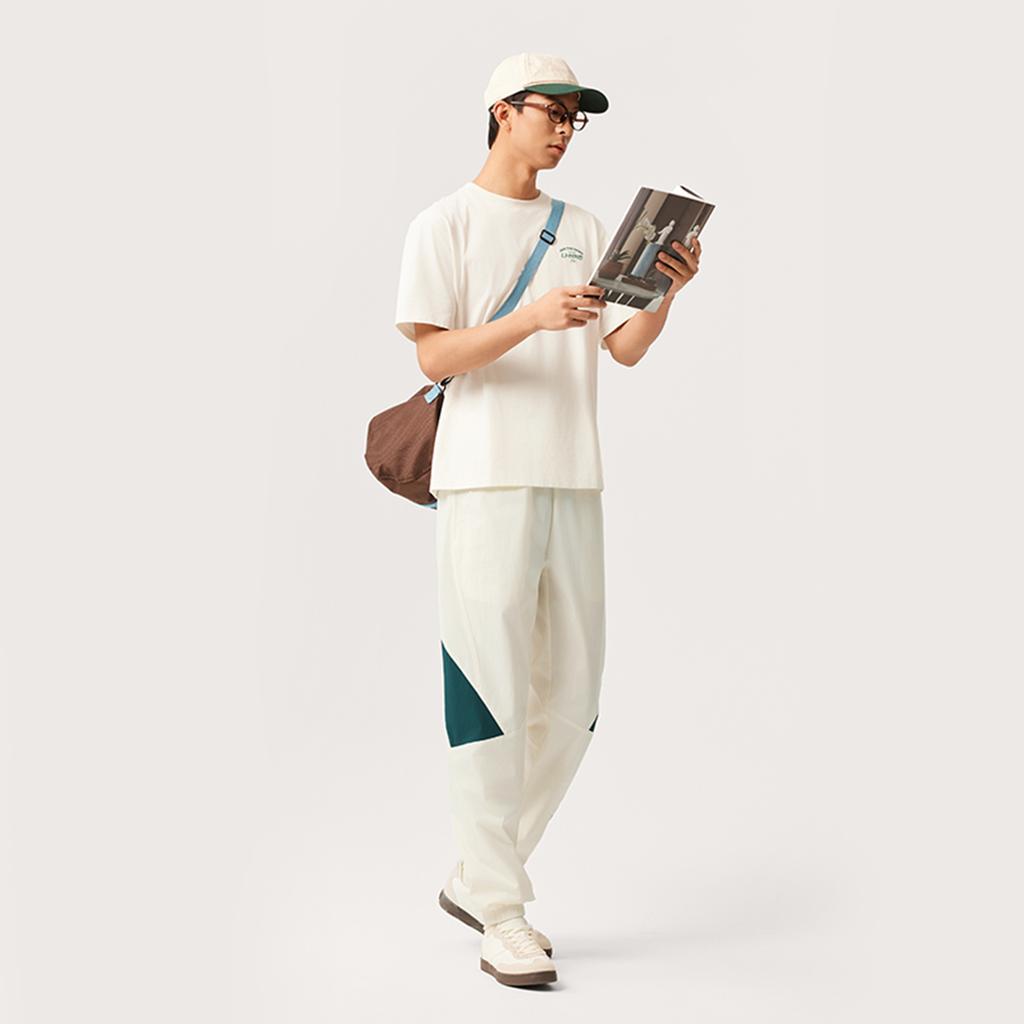 Li Ning Sports Trend Series Casual Versatile Comfortable Simple Color Block Elastic Cuffed Lace-Up Knitted Sports Pants Men pants Off-White AYKV161-4