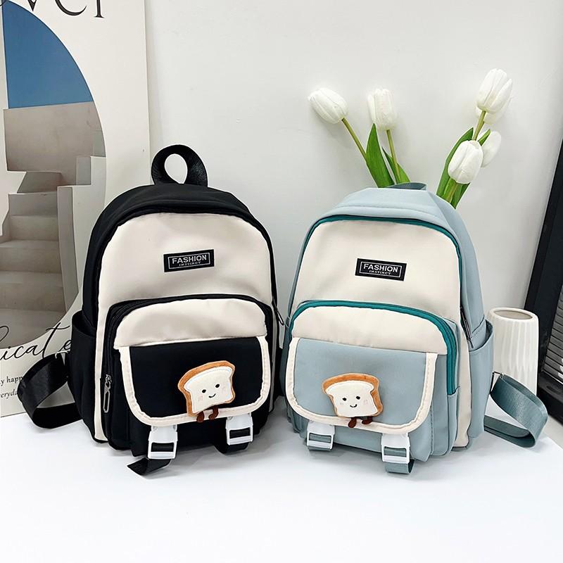New primary school students backpack women's new large-capacity first and second grade schoolbag simple and fashionable contrasting color backpack