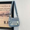 Borsa a tracolla in denim con ricamo di margherite Borsa a spalla da donna